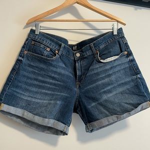 Medium wash denim shorts.